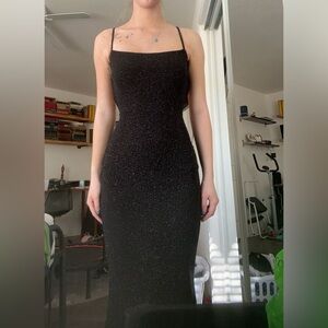 Sparkly black backless prom dress with bow